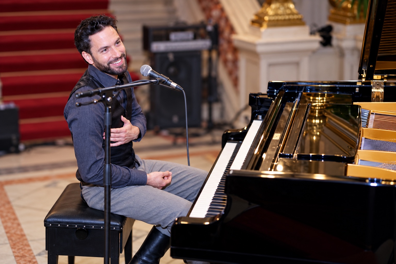 Marek performing at a grand piano during a live concert