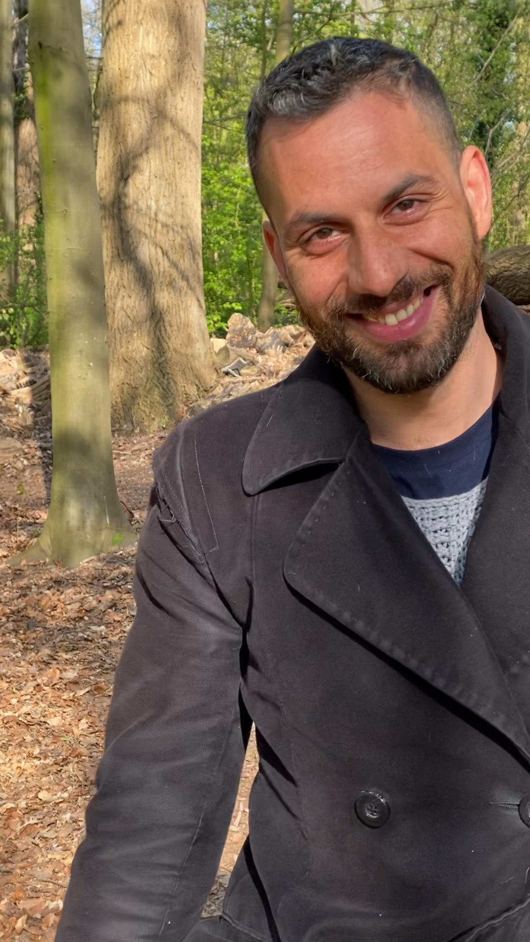 Marek smiling among the trees