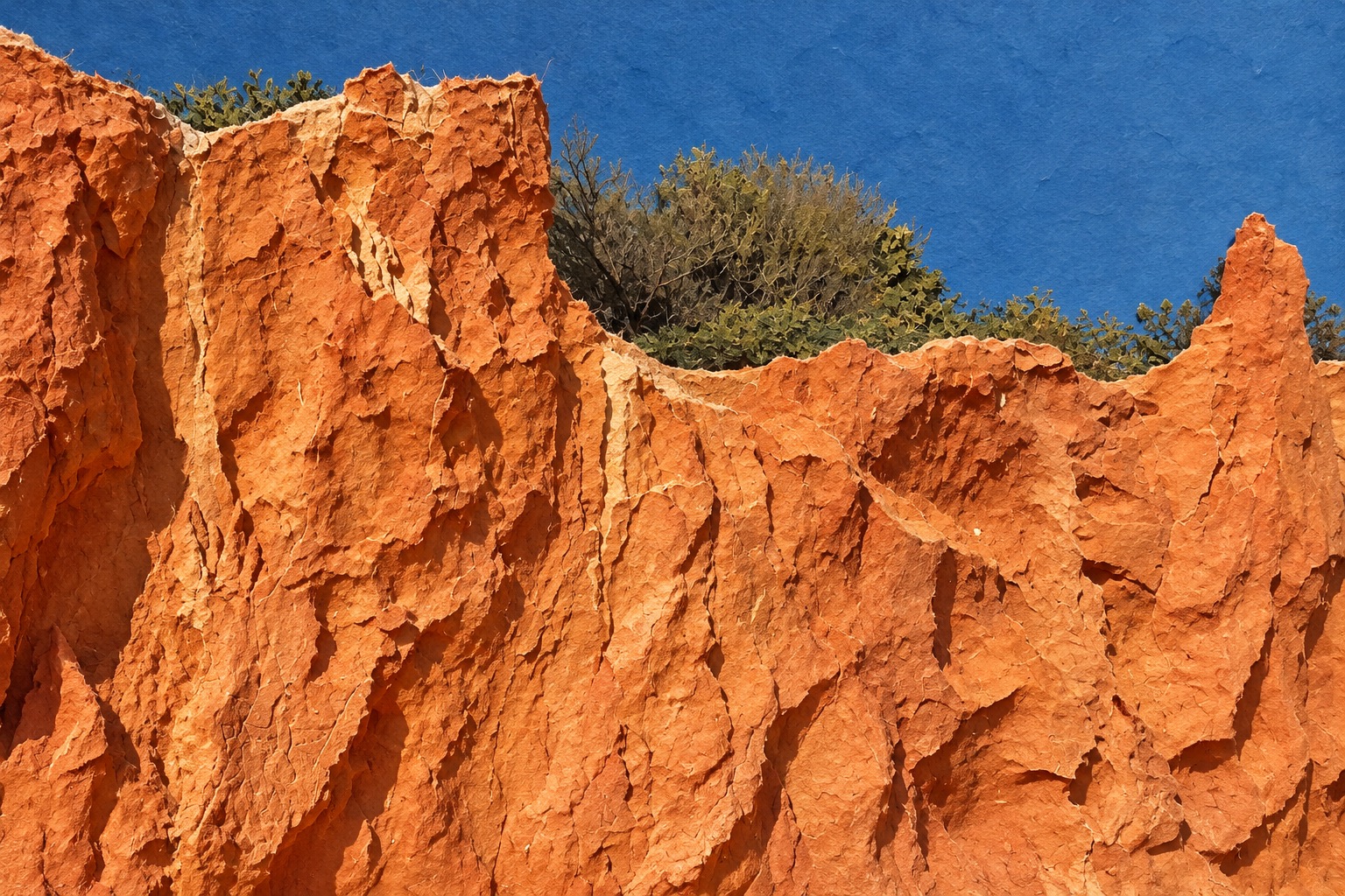 The supplied orange cliff photograph interpreted as layered terracotta paper